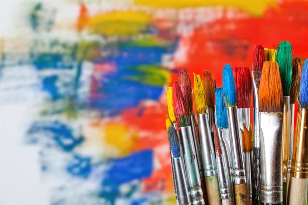 Paints and brushes — Stock Photo, Image