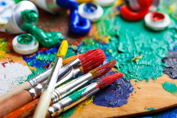 Paints and brushes — Stock Photo, Image