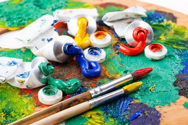 Paints and brushes — Stock Photo, Image