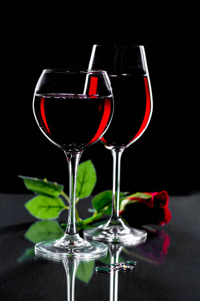 Glasses of wine on a black background.