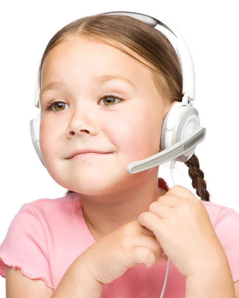 Cute little girl is talking to customers — Stock Photo, Image