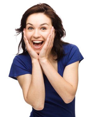 Woman is holding her face in astonishment clipart