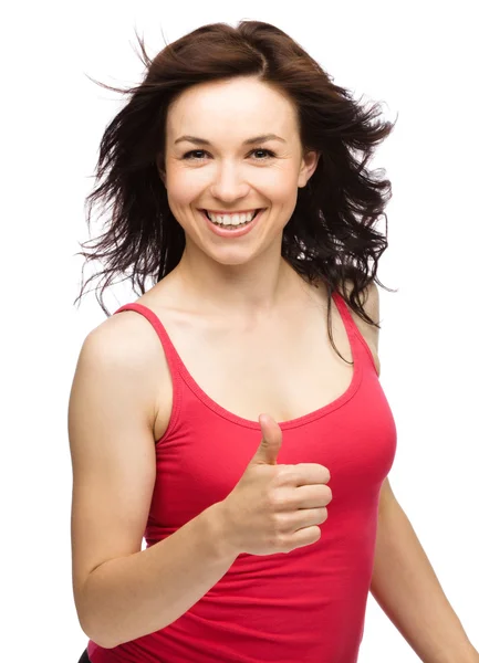 Woman is showing thumb up gesture — Stock Photo, Image