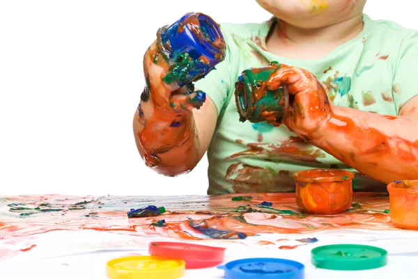 Child is grabbing some paint using fingers — Stock Photo, Image