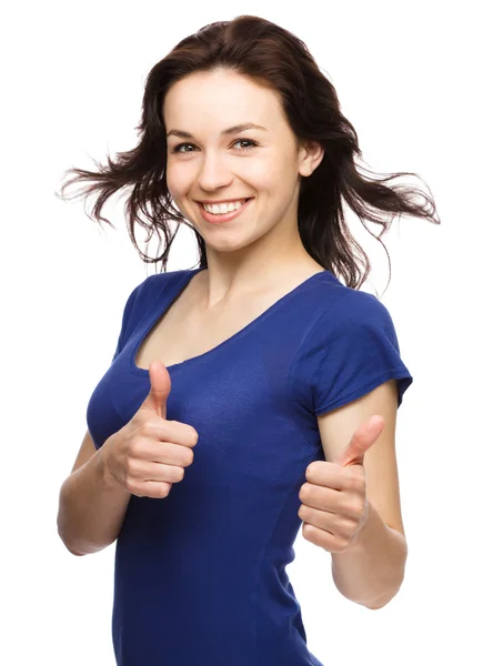 Woman is showing thumb up gesture — Stock Photo, Image