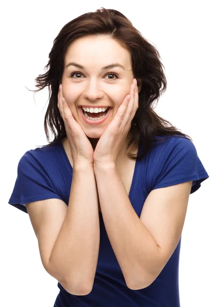 Woman is holding her face in astonishment — Stock Photo, Image