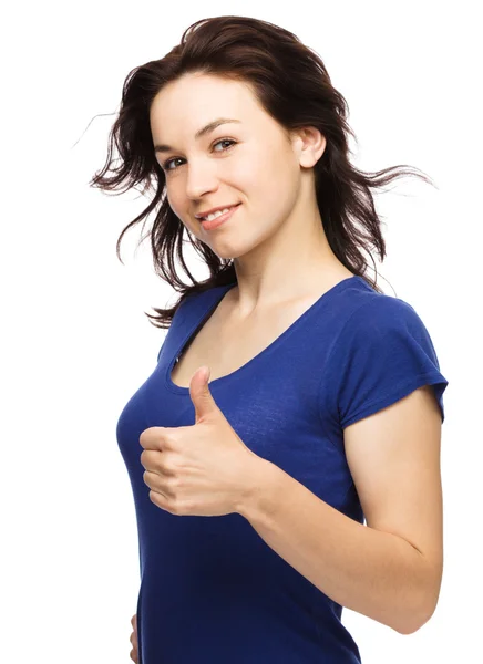 Woman is showing thumb up gesture — Stock Photo, Image