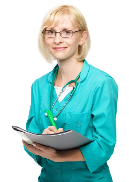 Porträtt av en kvinna som bär läkare uniform — Stockfoto