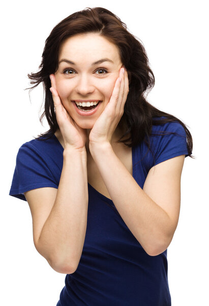 Woman is holding her face in astonishment