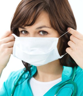 Doktor üniforması giyen bir kadın portresi
