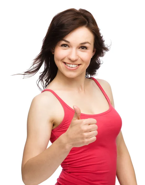 Woman is showing thumb up gesture — Stock Photo, Image