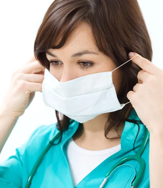 Portrait of a woman wearing doctor uniform — Stock Photo, Image