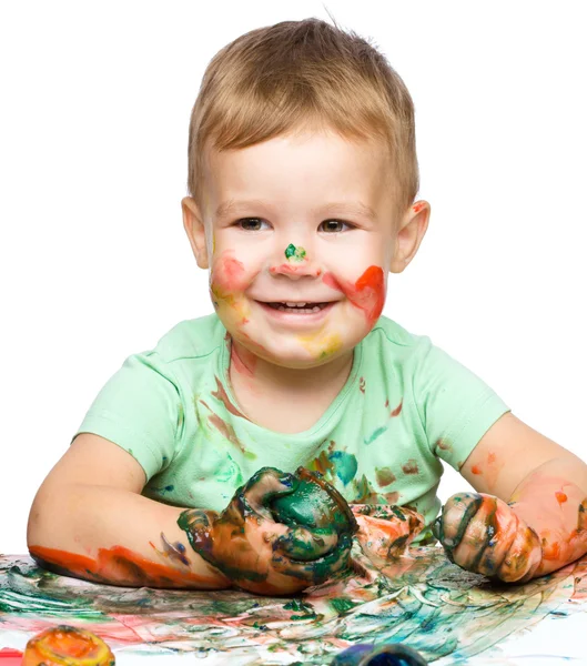 Little boy is playing with paints — Stock Photo, Image