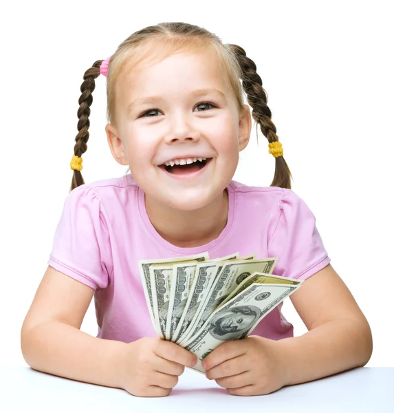 Little girl with dollars — Stock Photo, Image