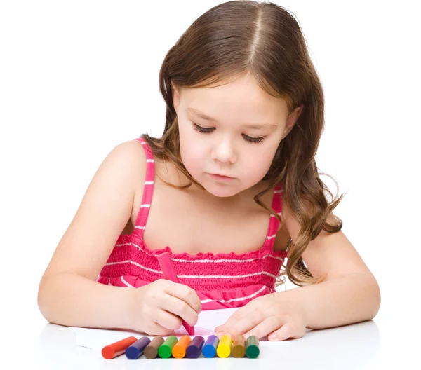 Little girl is drawing using a crayons — Stock Photo, Image