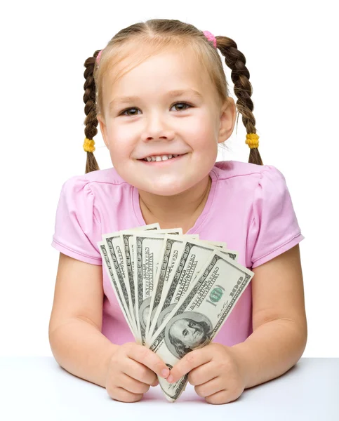 Dolar ile küçük kız — Stok fotoğraf