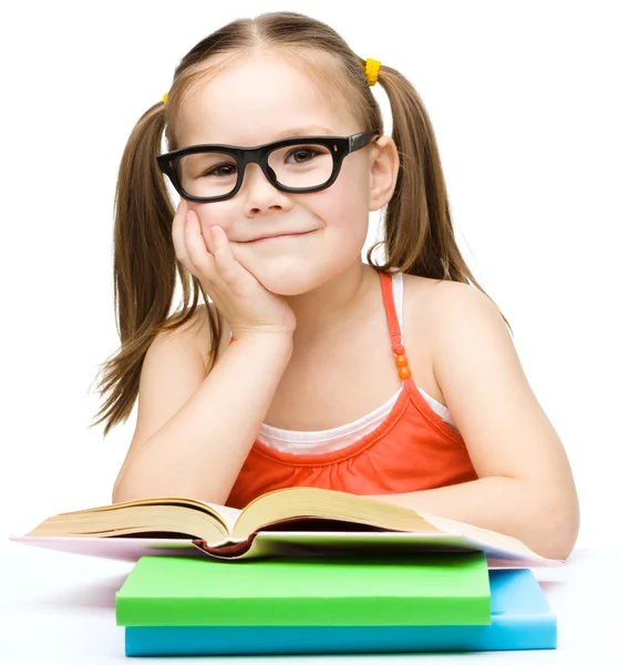 Little girl is reading a book — Stock Photo, Image