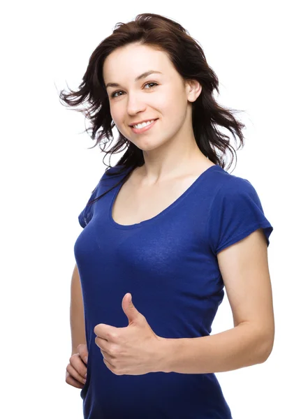 Woman is showing thumb up gesture — Stock Photo, Image