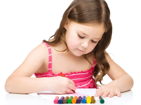 Little girl is drawing using a crayon — Stock Photo, Image