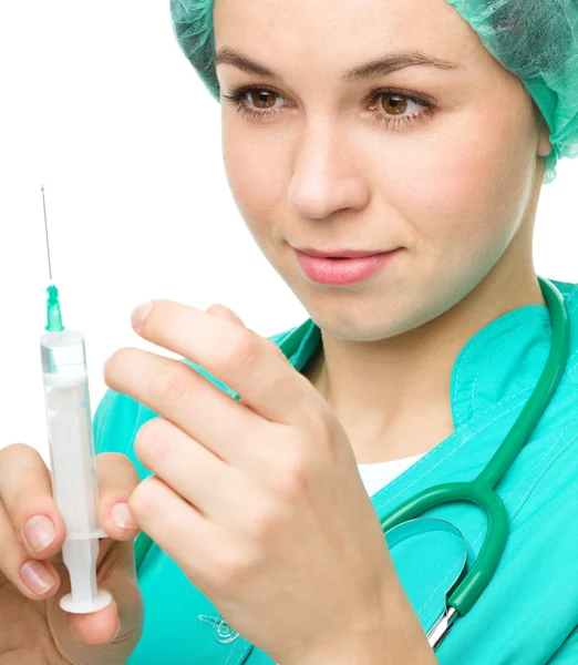 Young nurse is preparing syringe for injection — Stock Photo, Image