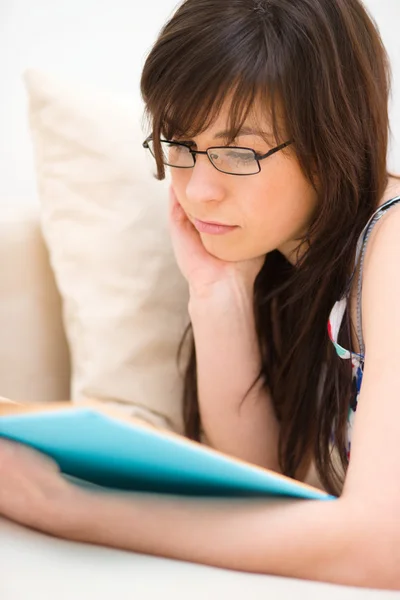 Woman is reading a book Royalty Free Stock Photos