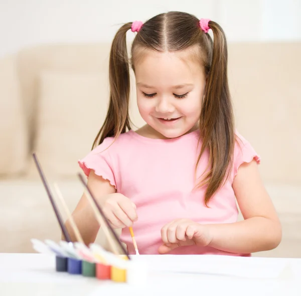 Cute cheerful child play with paints — Stock Photo, Image