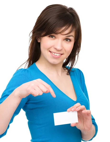 Young woman is holding visit card — Stock Photo, Image