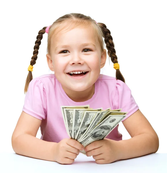 Little girl with dollars — Stock Photo, Image