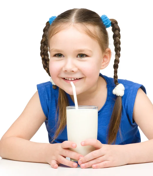 Cute little girl with a glass of milk — Stock Photo, Image