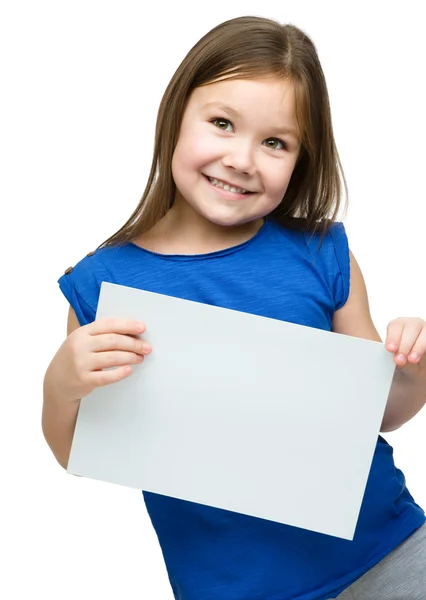 Little girl is holding blank banner — Stock Photo, Image