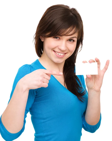 Young woman is holding visit card Stock Image