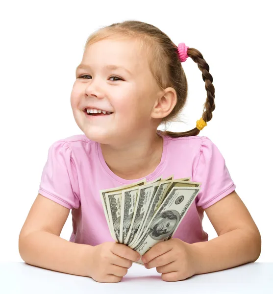 Little girl with dollars — Stock Photo, Image