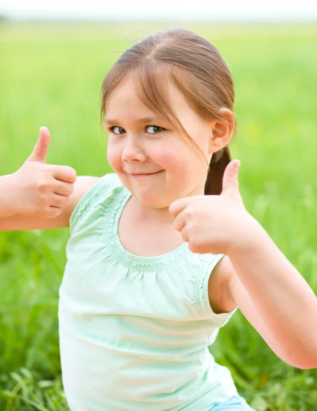 Niña está mostrando el pulgar hacia arriba gesto —  Fotos de Stock