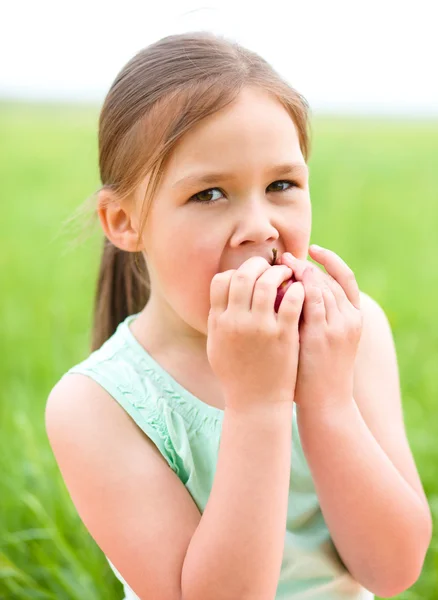 Portrait of a little girl with apple — Stock Photo, Image