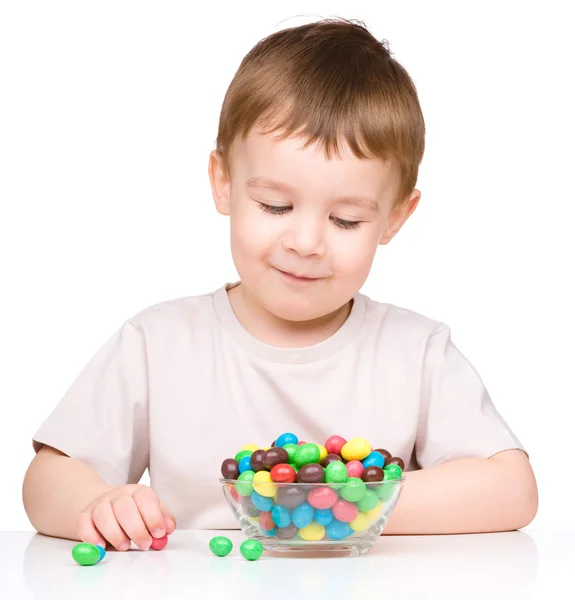 Portrait of a boy with candies — Stock Photo, Image