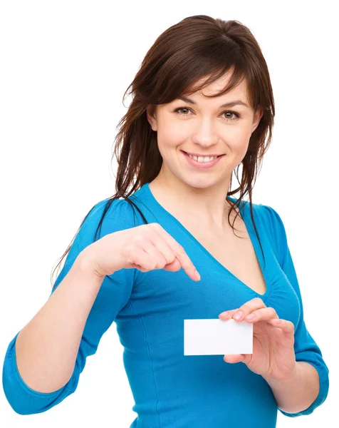 Young woman is holding visit card — Stock Photo, Image