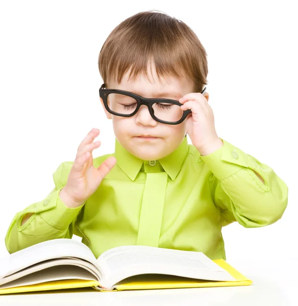 Little child play with book Stock Image