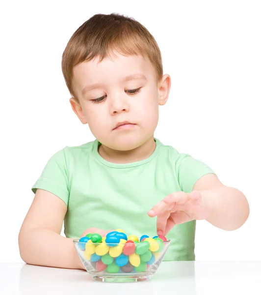 Portrait of a boy with candies — Stock Photo, Image