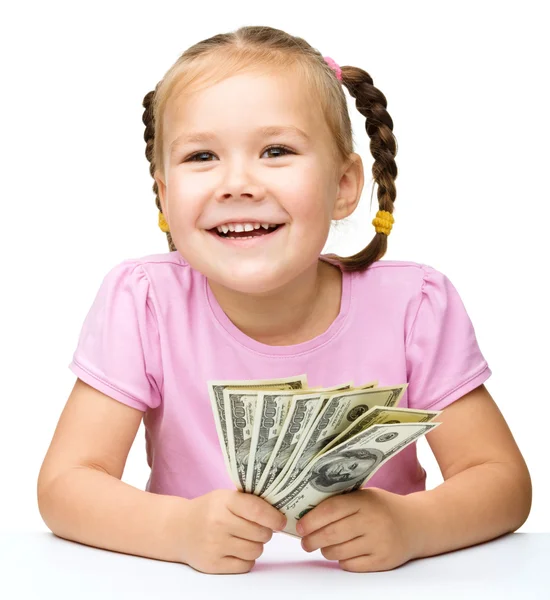 Little girl with dollars — Stock Photo, Image