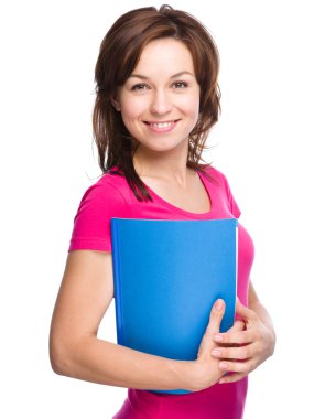 sıska genç öğrenci kız alıştırma kitabı düzenliyor