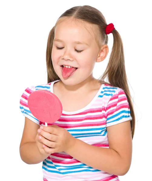 Klein meisje gaat te likken haar lolly — Stockfoto