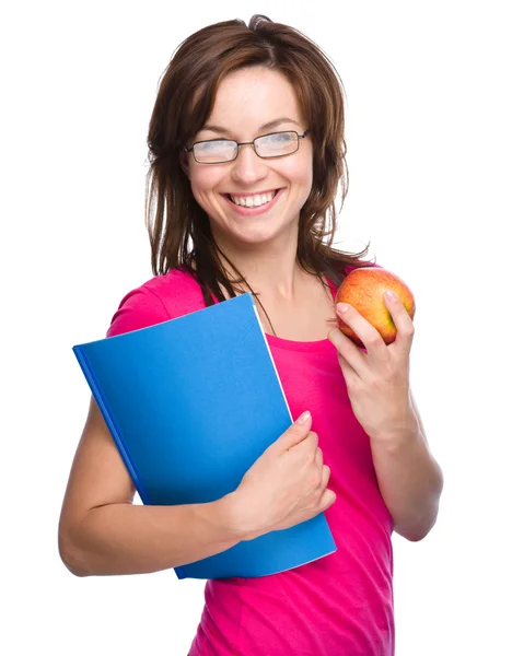 Jeune fille étudiante tient livre et pomme — Photo