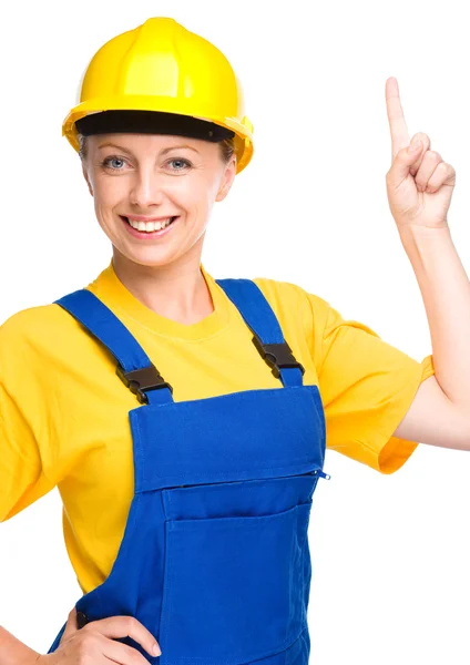 Young construction worker pointing up — Stock Photo, Image