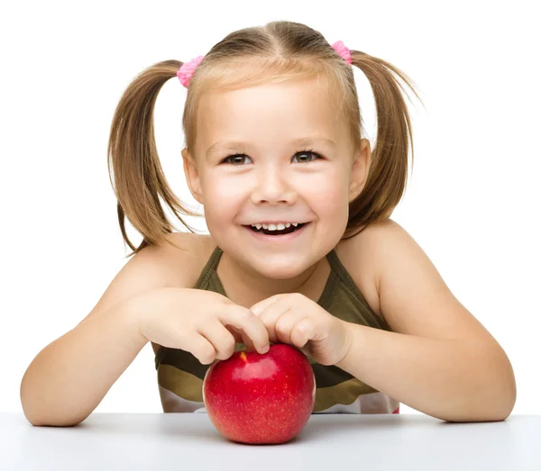 Little girl with red apple — Stock Photo, Image