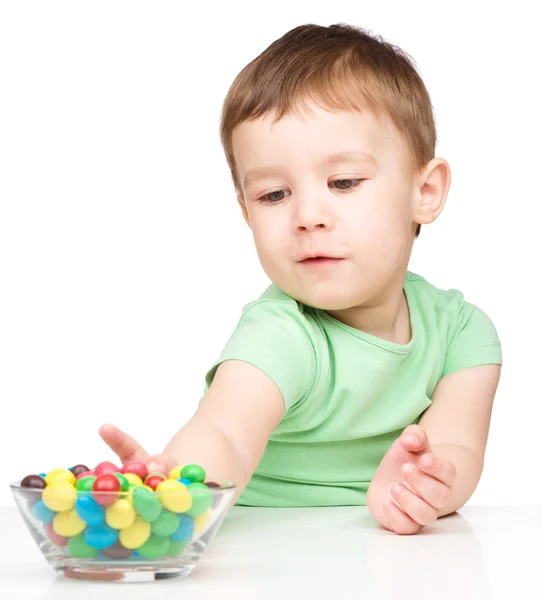 Little boy refusing to eat candies — Stock Photo, Image