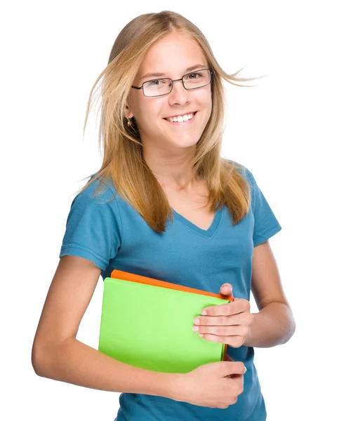 Joven estudiante chica está sosteniendo libro — Foto de Stock