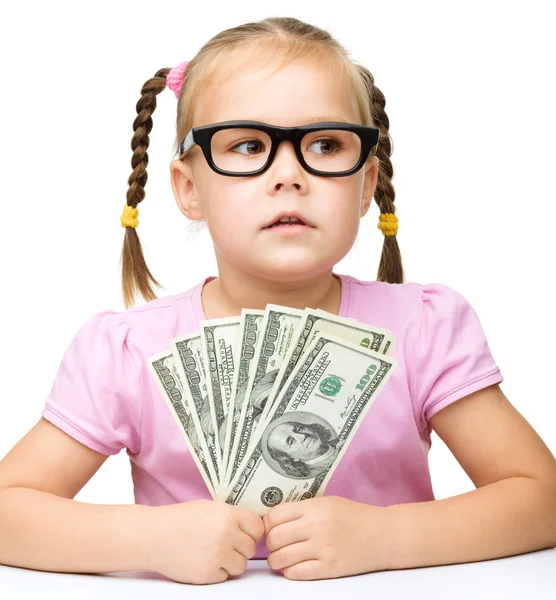 Little girl is counting dollars — Stock Photo, Image