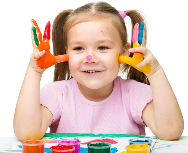 Portrait of a cute girl playing with paints — Stock Photo, Image