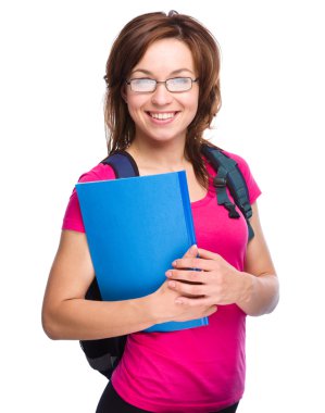 Genç öğrenci kız kitap tutuyor