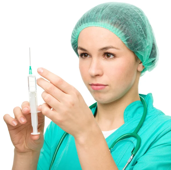 Young nurse is preparing syringe for injection — Stock Photo, Image